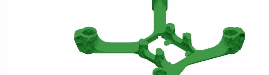 A young woman working in a machine shop. She is looking directly towards the camera, and is surrounded by men.