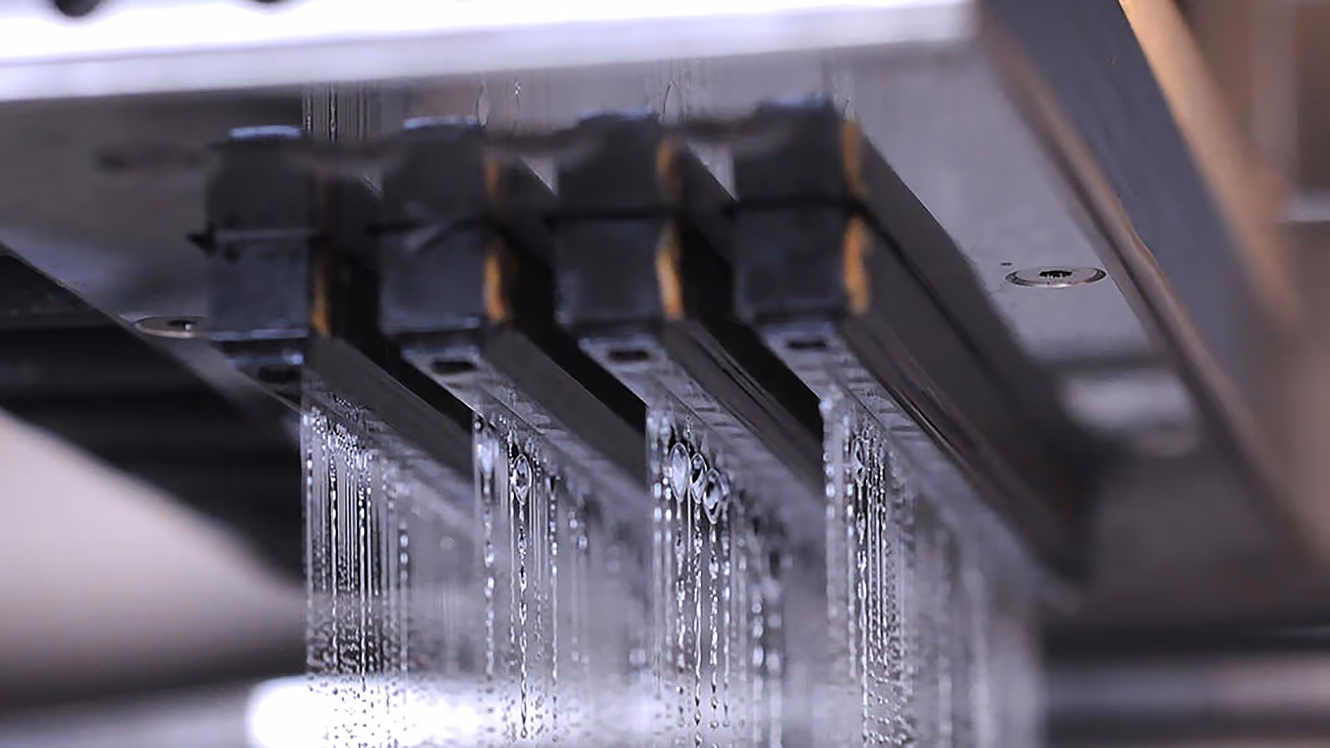 Printheads depositing binder Image credit ExOne