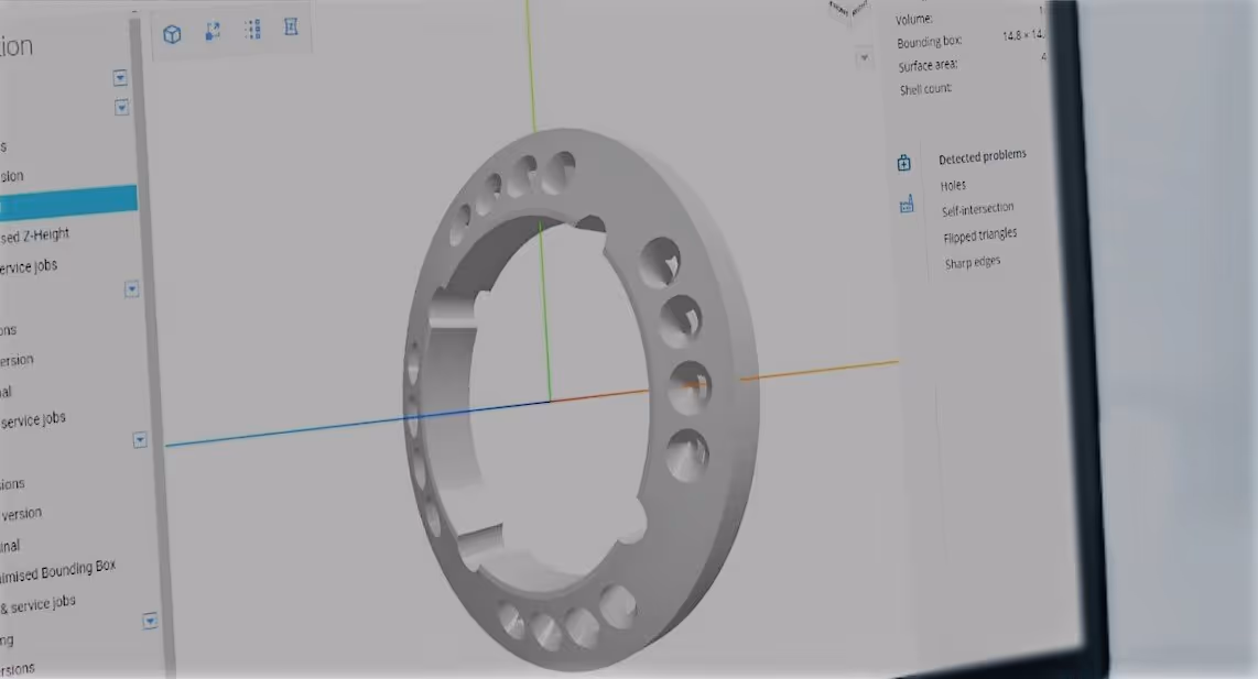 A young woman working in a machine shop. She is looking directly towards the camera, and is surrounded by men.