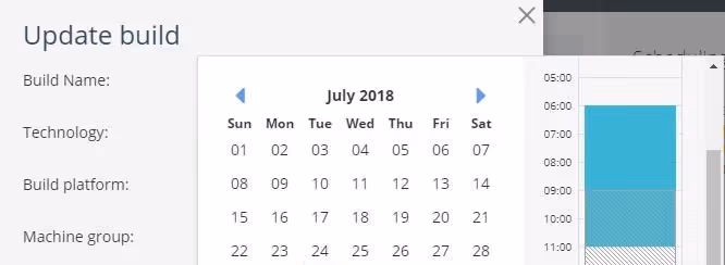 A young woman working in a machine shop. She is looking directly towards the camera, and is surrounded by men.