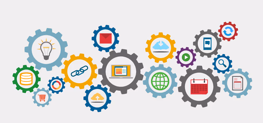 A young woman working in a machine shop. She is looking directly towards the camera, and is surrounded by men.