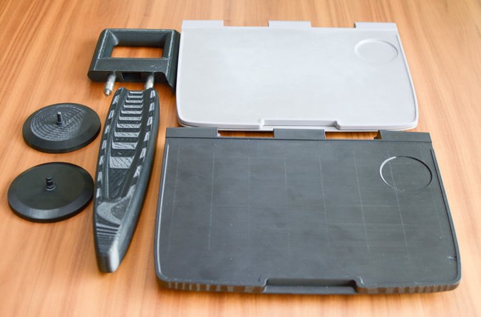 FDM 3D-printed parts (from left to right): Electrical connection covers, grab handle arm rest and seatback table [Image credit: Angel Trains]