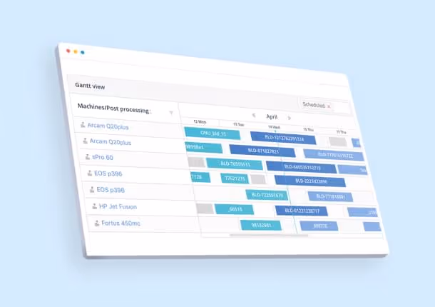 A young woman working in a machine shop. She is looking directly towards the camera, and is surrounded by men.