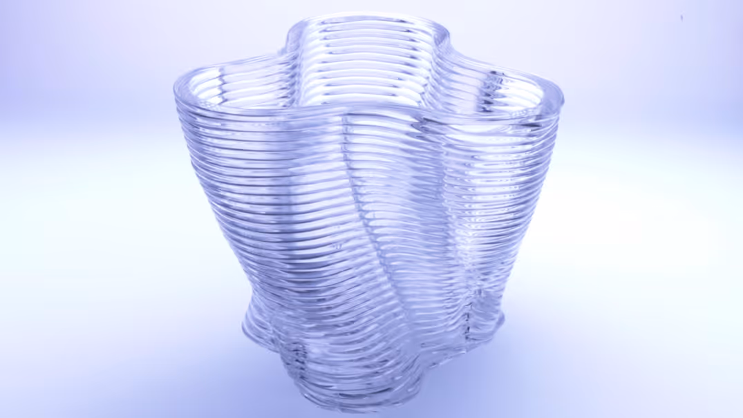 A young woman working in a machine shop. She is looking directly towards the camera, and is surrounded by men.