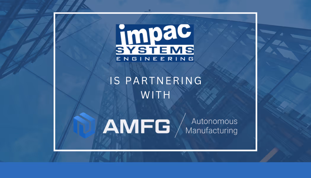 A young woman working in a machine shop. She is looking directly towards the camera, and is surrounded by men.