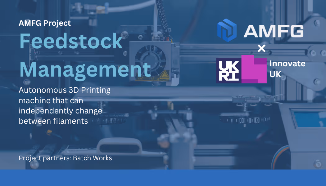 A young woman working in a machine shop. She is looking directly towards the camera, and is surrounded by men.