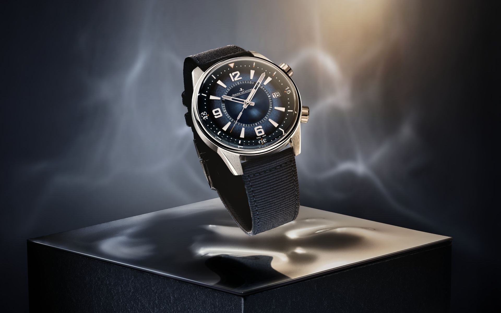 Luxury watch displayed on a pedestal with dramatic lighting for L'Imagerie Films luxury video production.