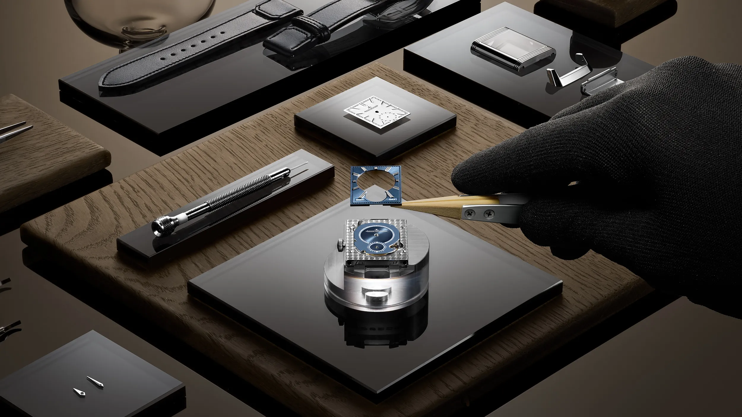 Craftsperson assembling a luxury wristwatch at a workbench for L'Imagerie Films luxury video production.