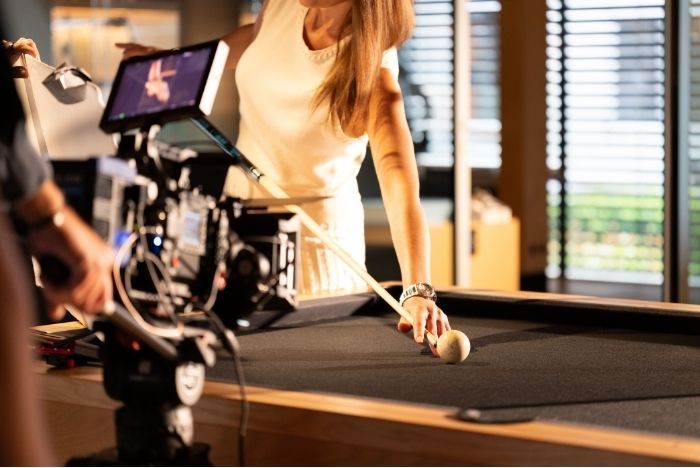 Woman wearing a wristwatch during luxury brand film production with a cinema camera by L'Imagerie Films.