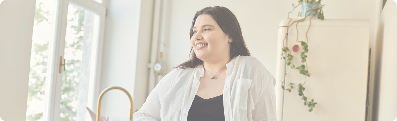 A happy woman in a  room.