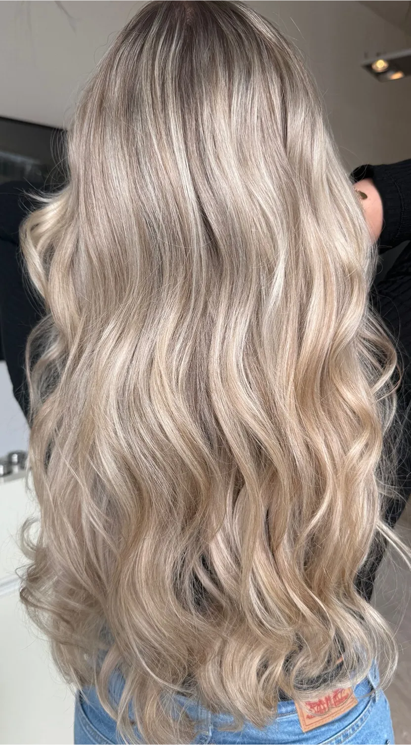 A woman with blonde hair in a salon.