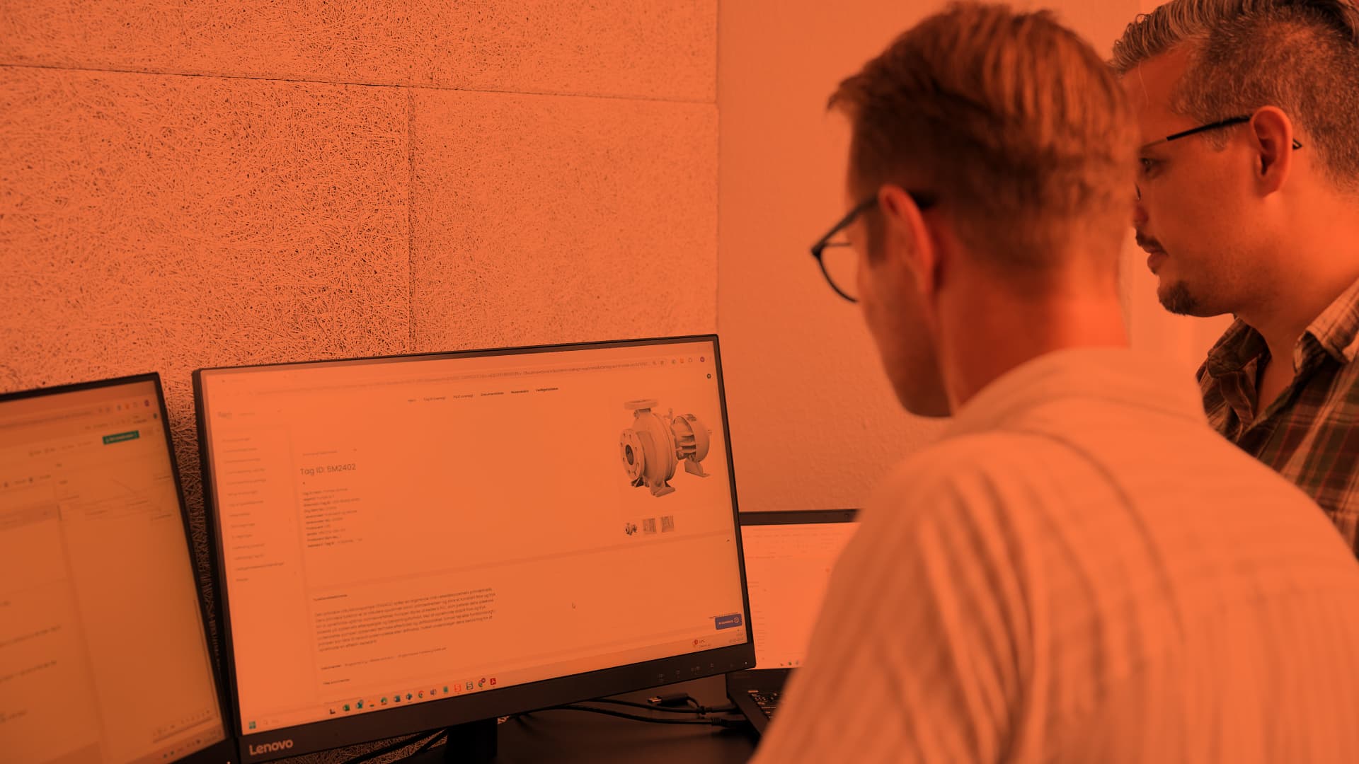 Two men looking at computer screens