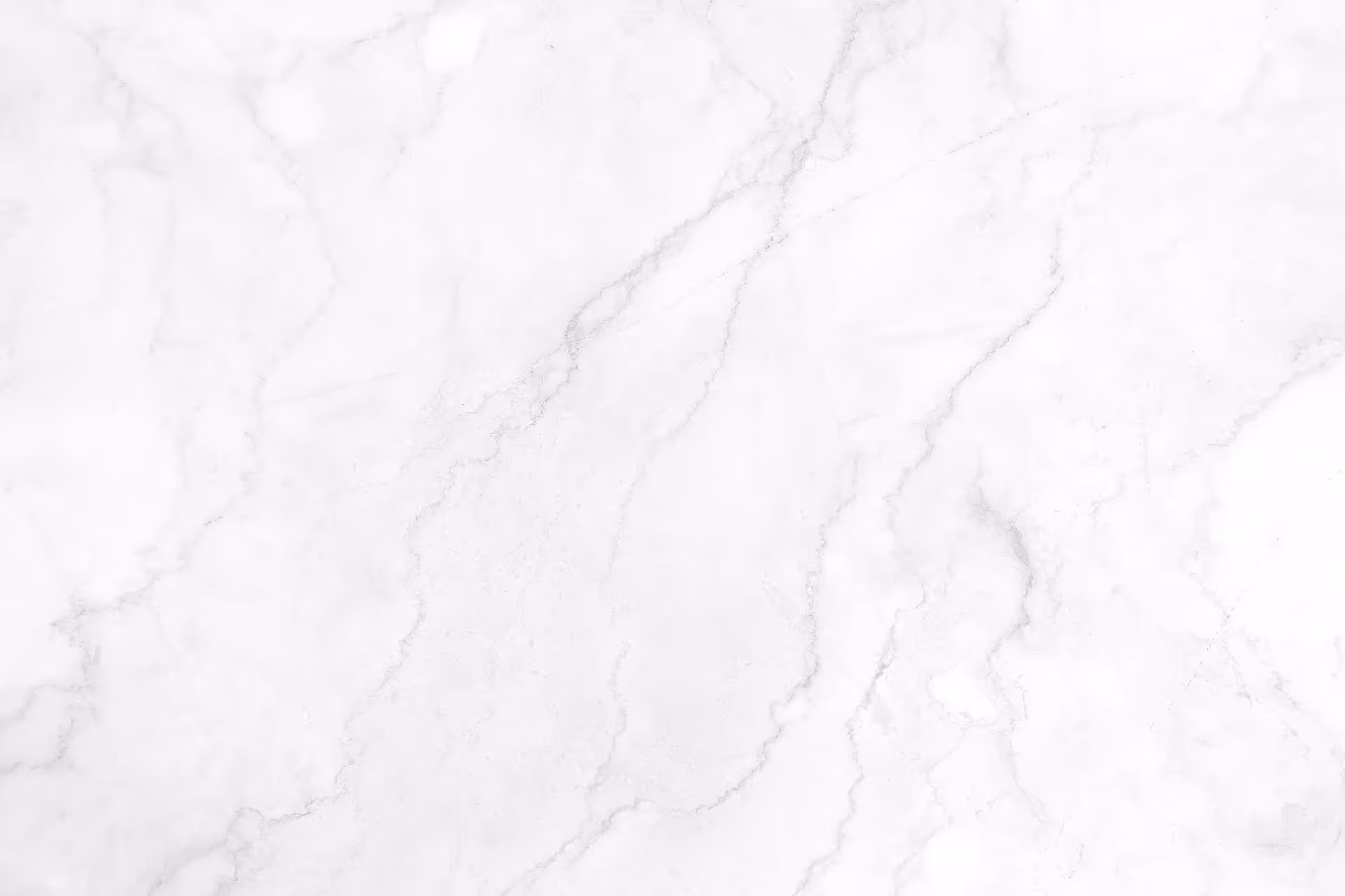 A white marble background with a black border.