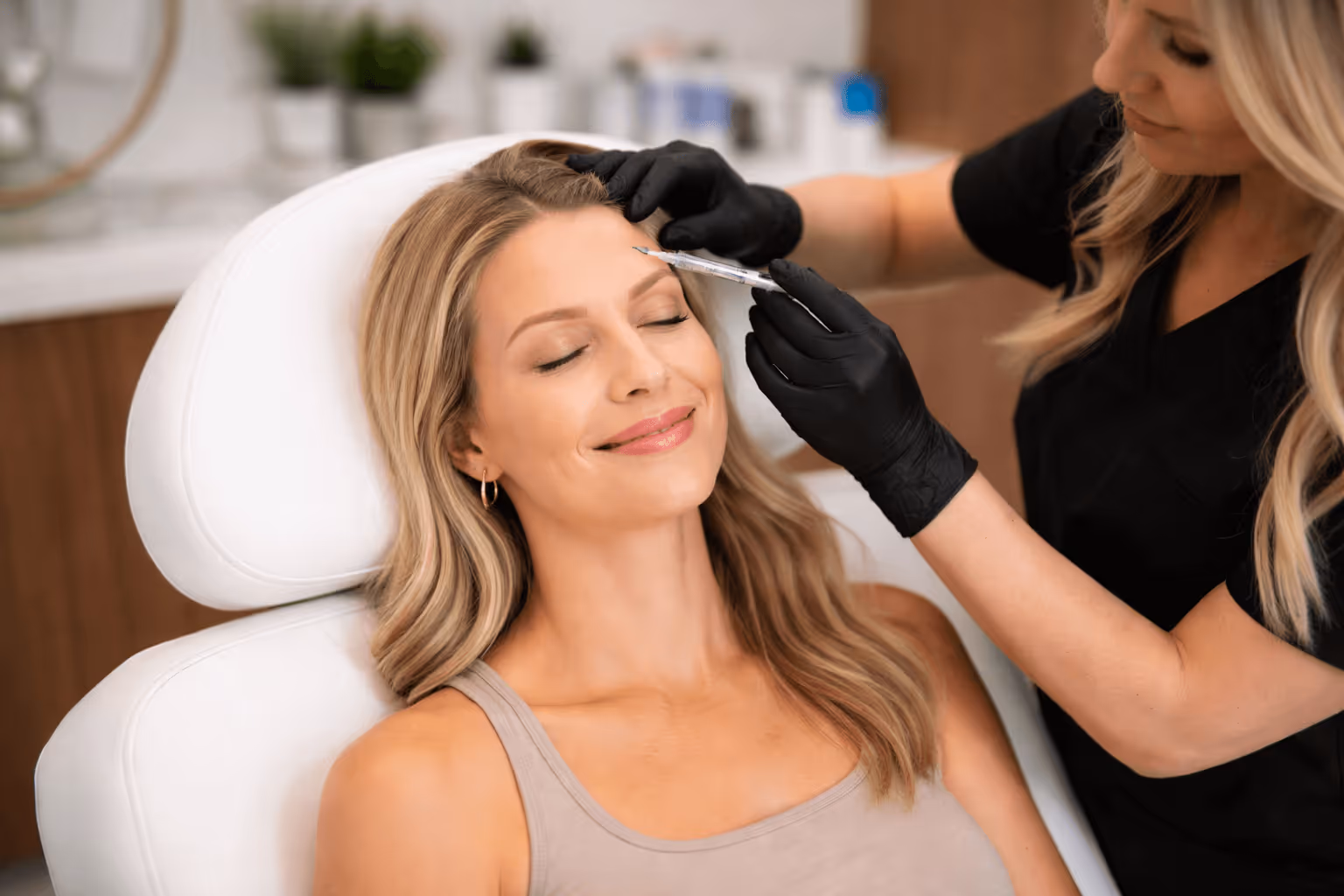 Patient receiving Botox treatment in Dallas, Texas at a modern medical spa setting