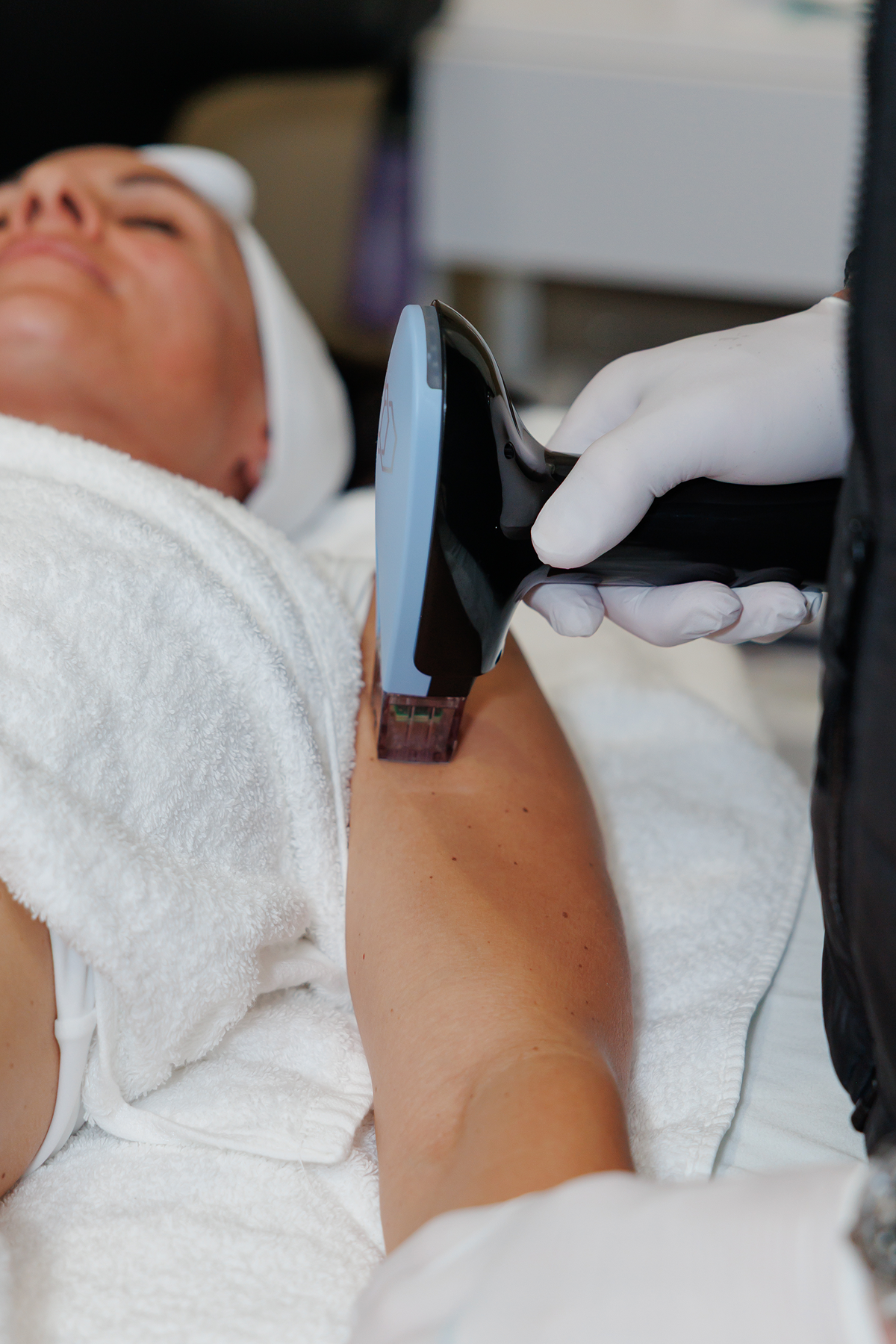 Patient receiving an EMFACE facial contouring treatment at a medspa to improve skin firmness, lift facial features, and reduce the appearance of wrinkles.