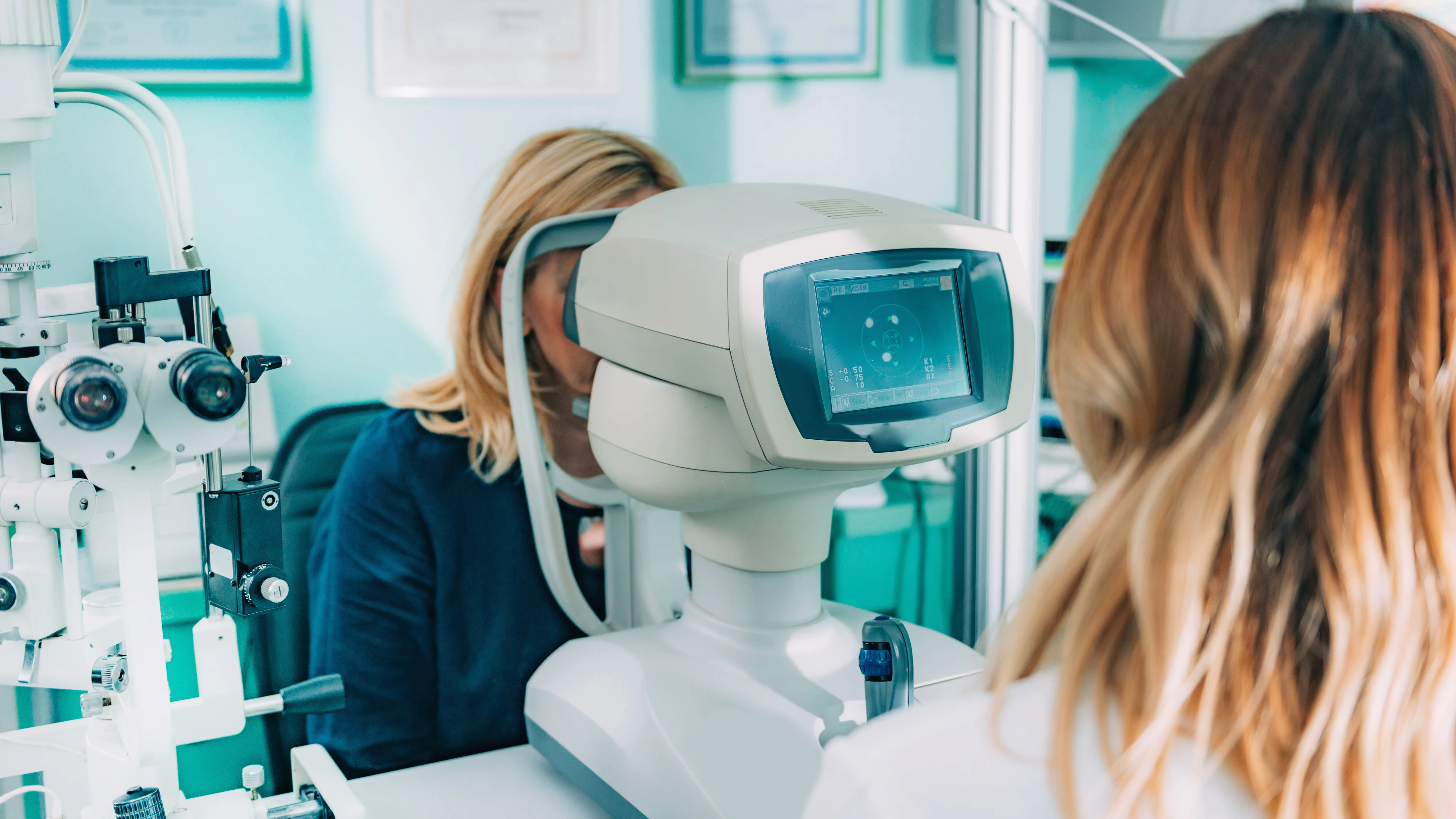 Eye examination with modern optometry equipment in medical clinic