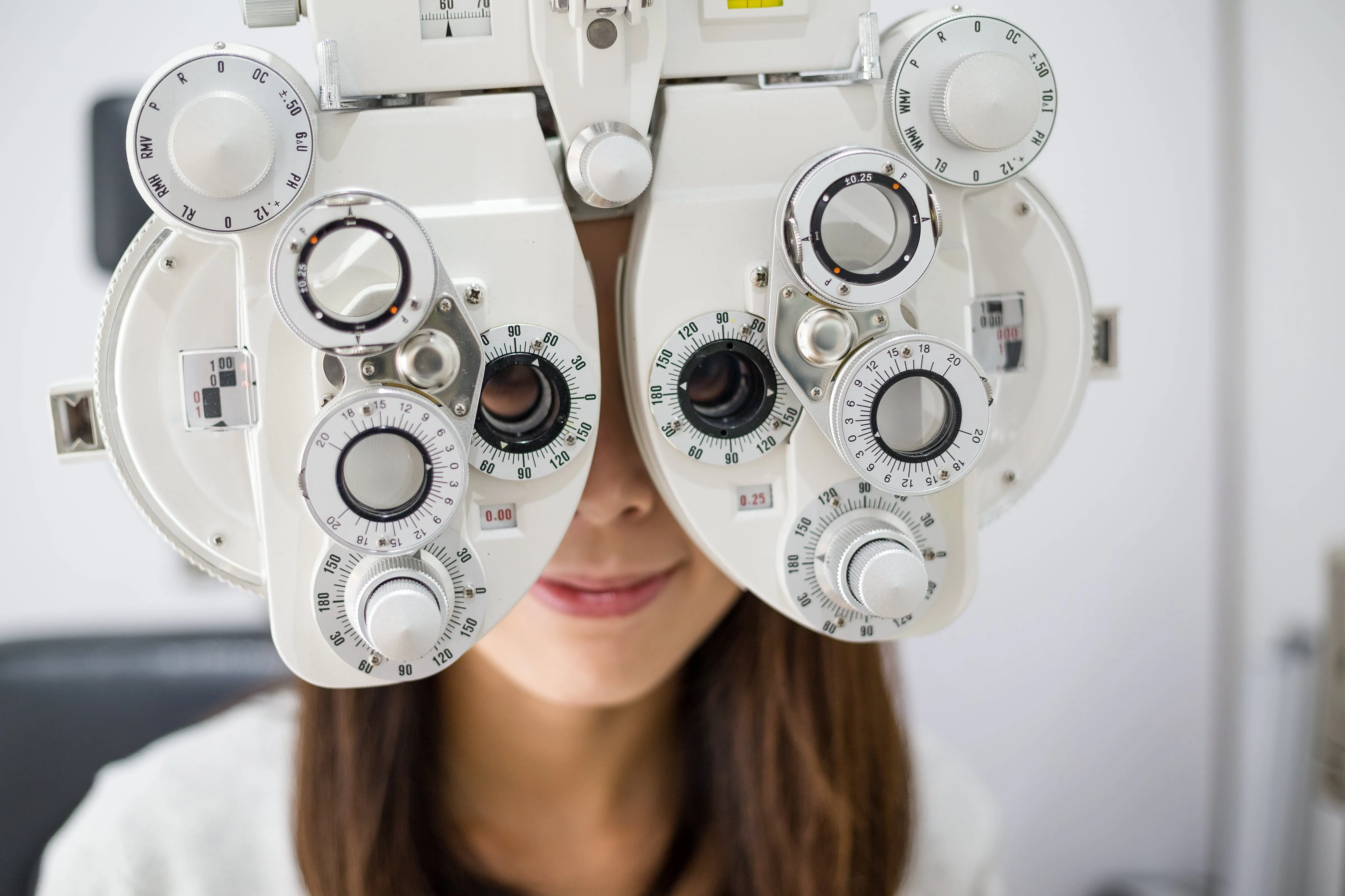 Eye exam with phoropter, professional checking vision with optical device