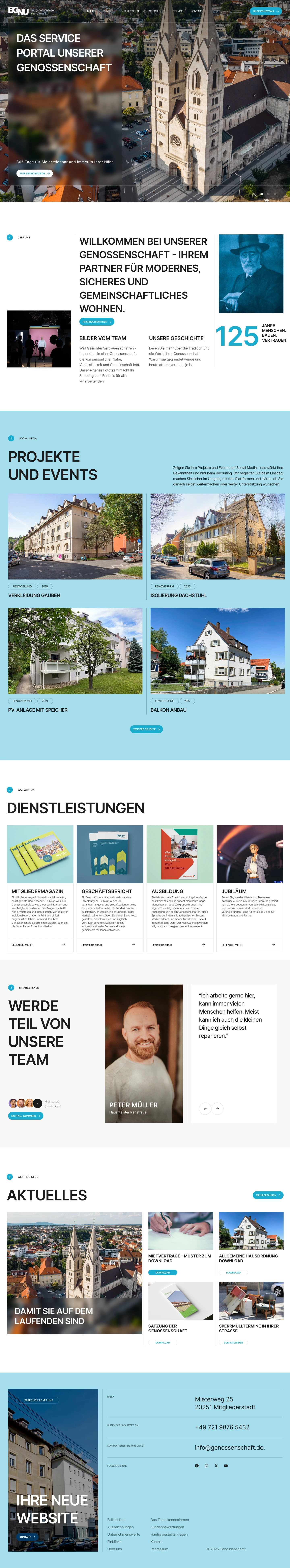 Aerial view of a large historic church with twin towers surrounded by buildings in a small city.