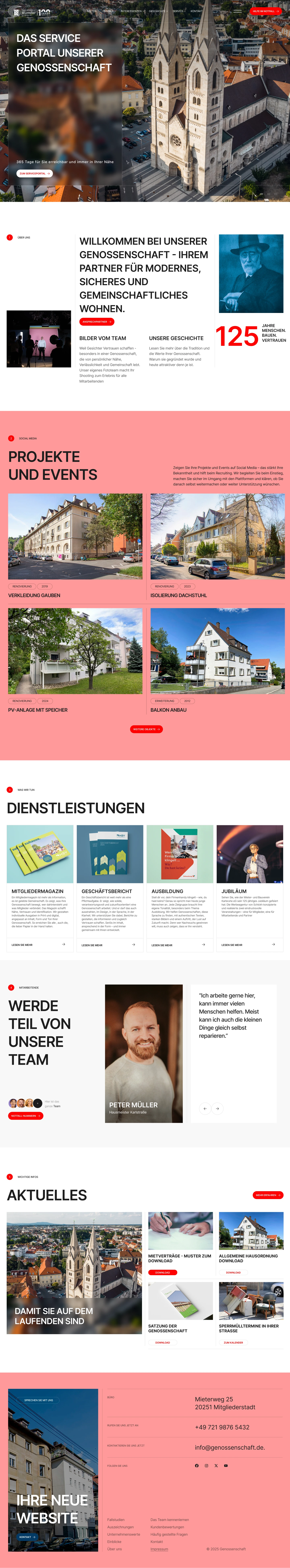 Aerial view of a city with a large twin-towered church in the center, surrounded by residential buildings and streets.