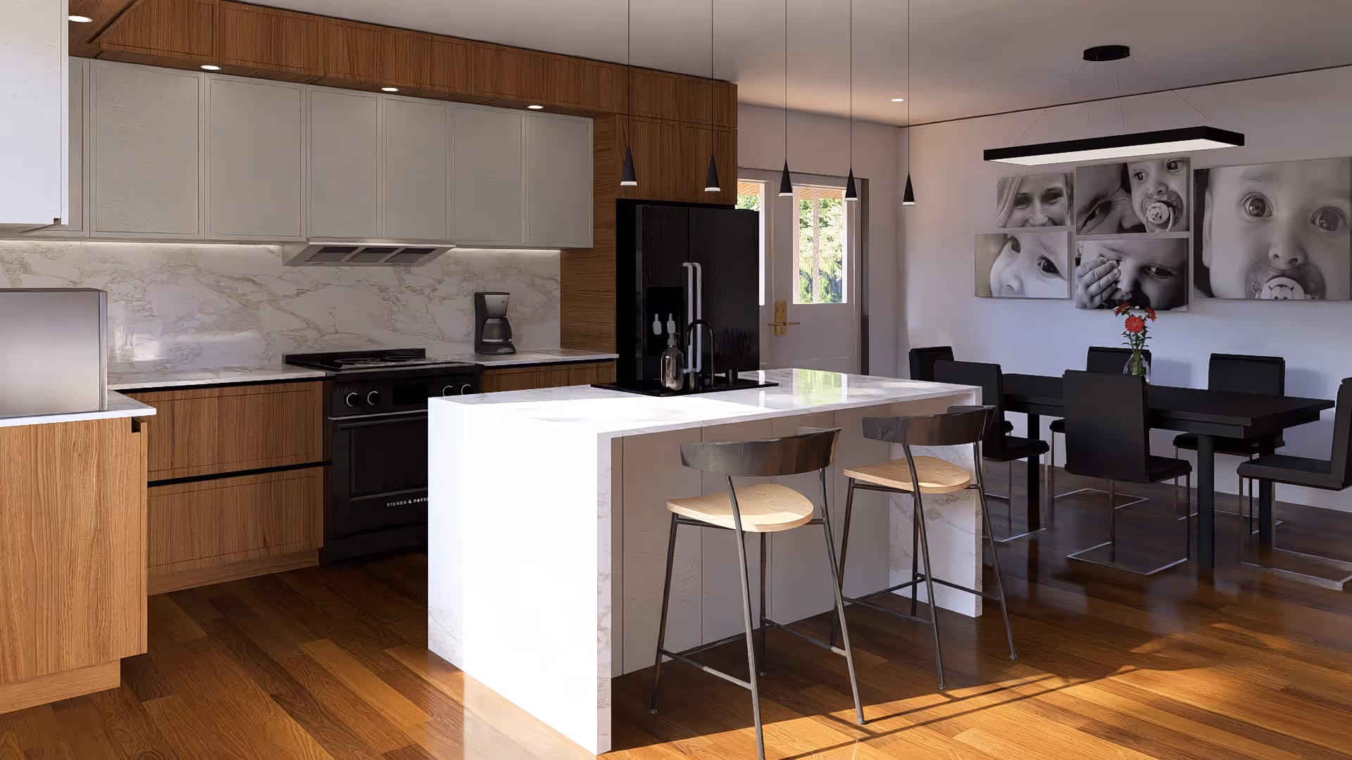 Cuisine moderne avec îlot central en marbre blanc, deux tabourets en bois clair et noir, électroménagers noirs et mur avec photos en noir et blanc d'enfants.