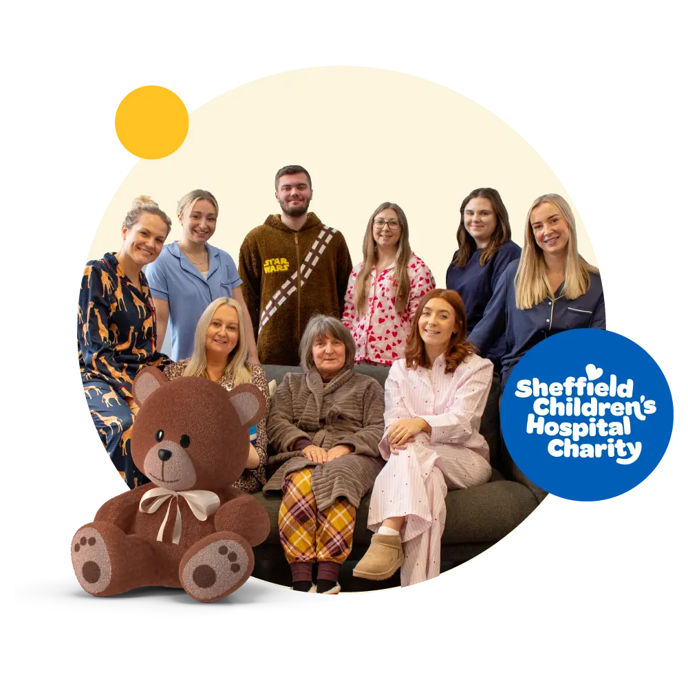 People dressed in pyjamas with pop out of Sheffield Children's Hospital Charity logo