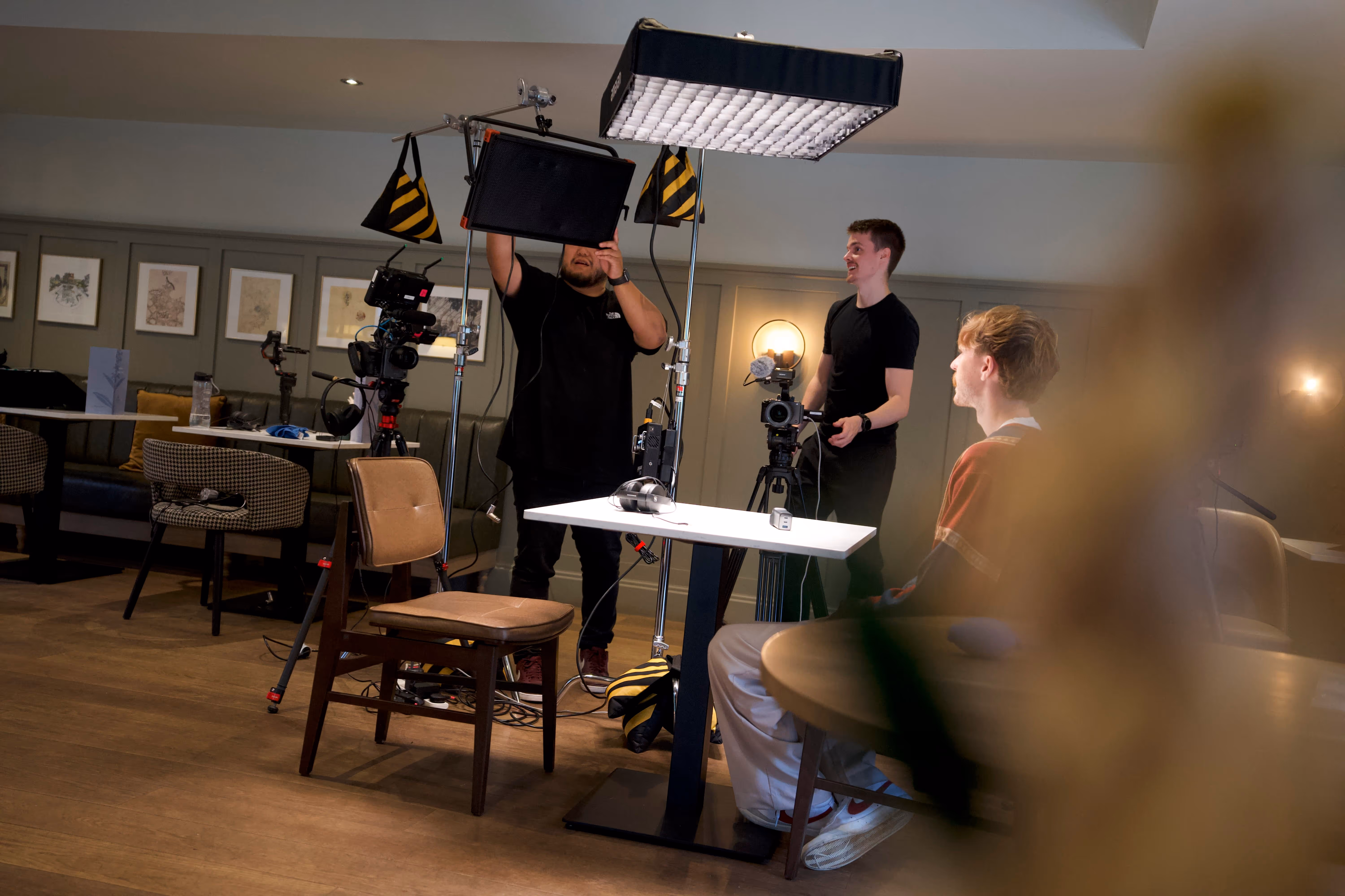 REAS Group production team setting up lights and cameras during video shoot