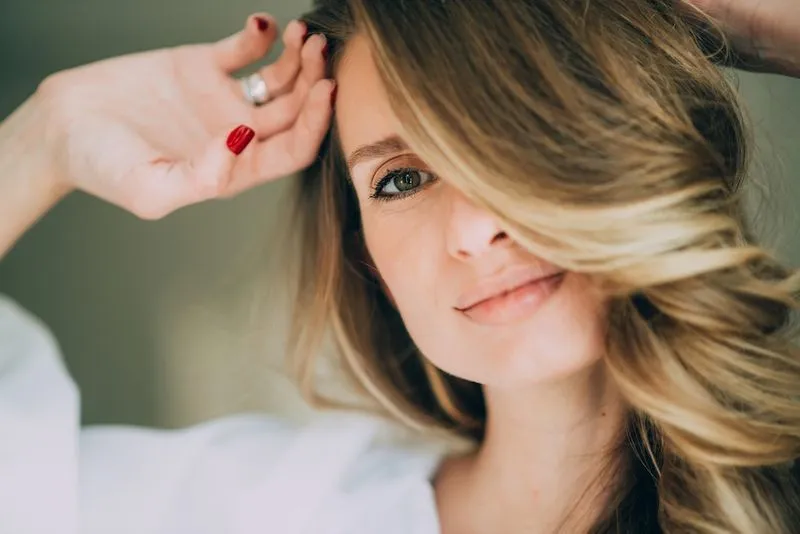 A close up of a woman with long hair.