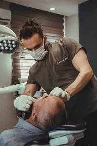 Private dentist taking care of the patient