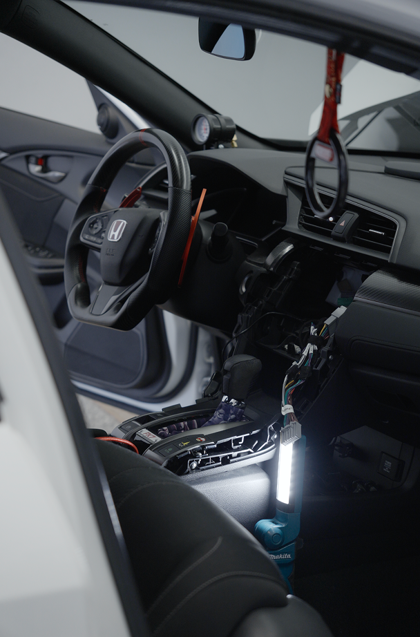 Interior of a honda civic sport being upgraded with a sound system