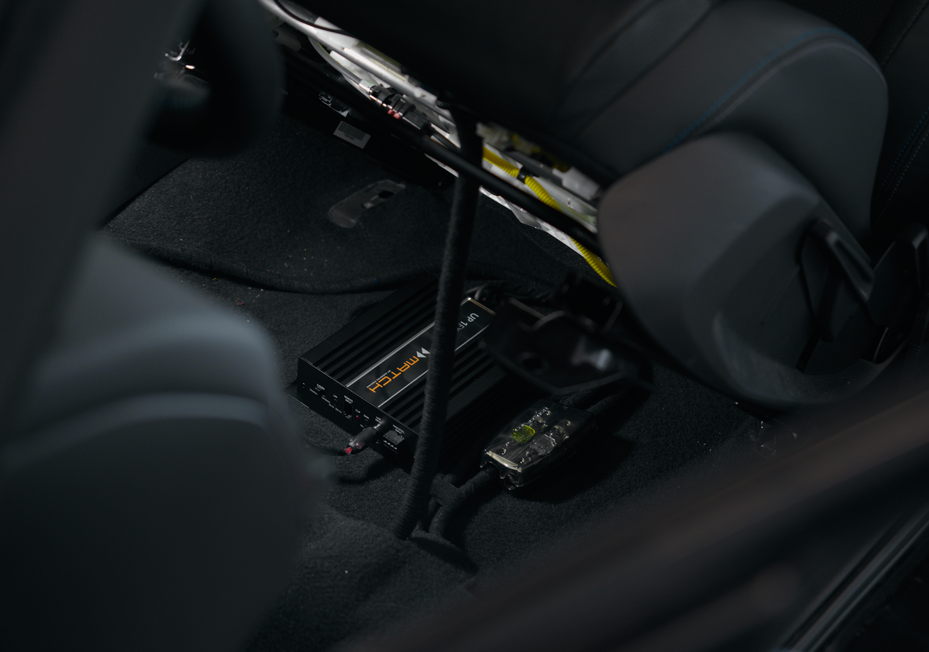 MATCH DSP installed in a car seat.