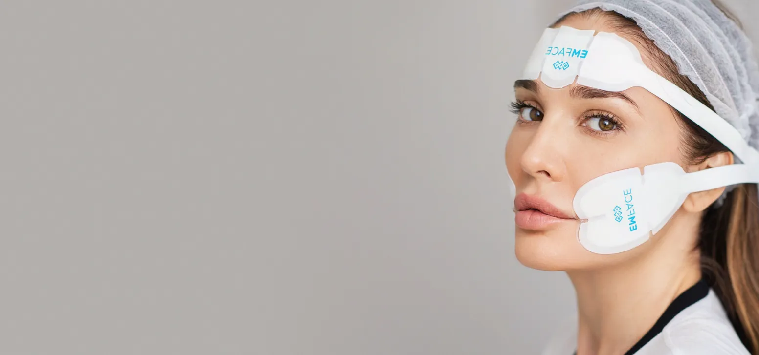 A woman using Emface