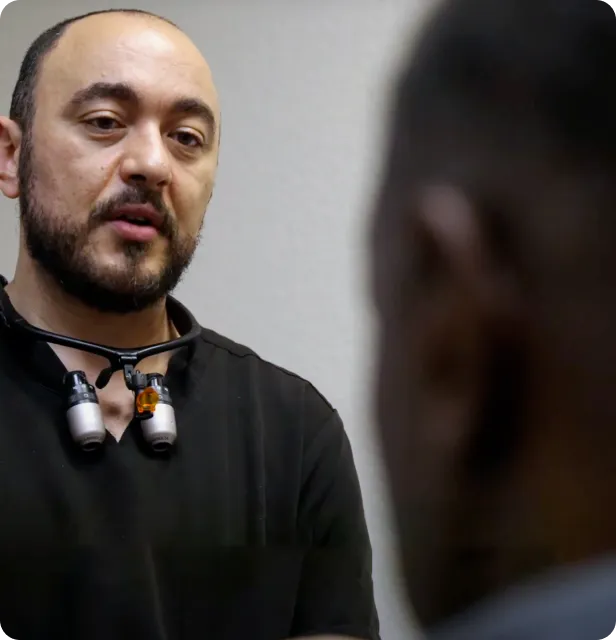 A man with a stethoscope on his neck.