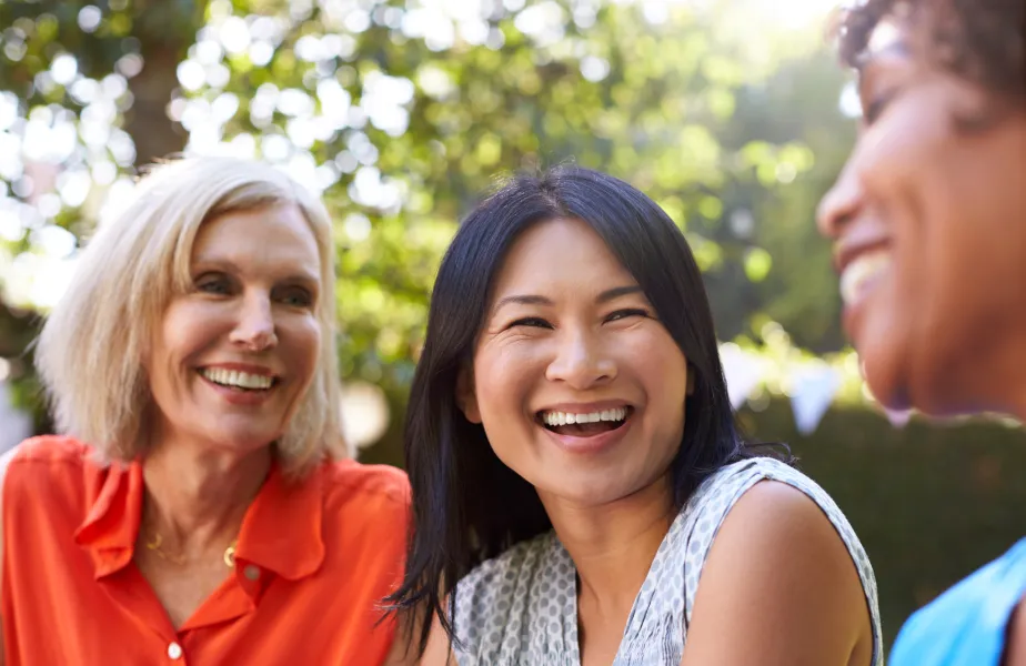 A group of women sitting next to each other.