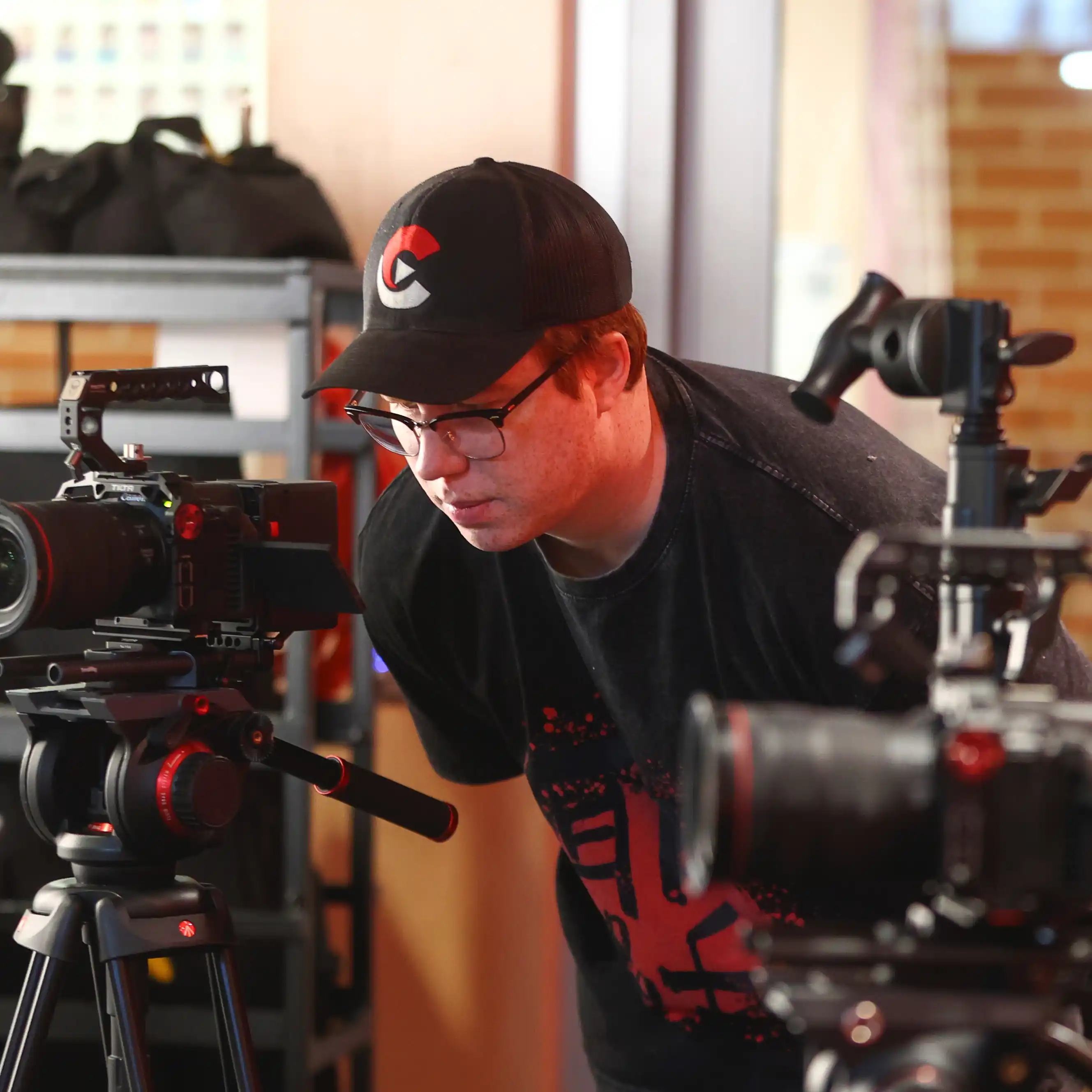 Close-up of camera operator at work—Chesser Media documentary filmmaking.