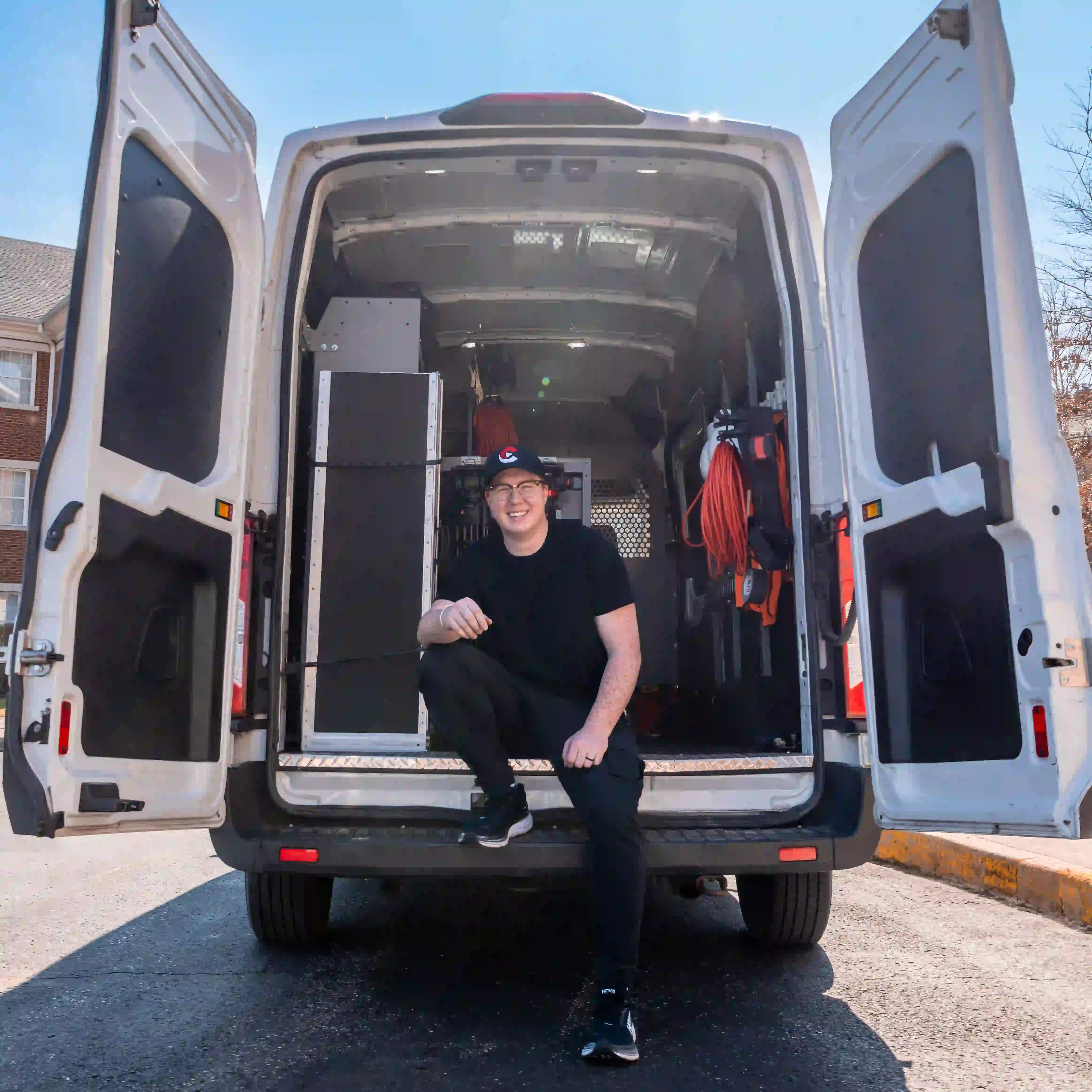 Rear van doors open with gear—Chesser Media mobile production transport.
