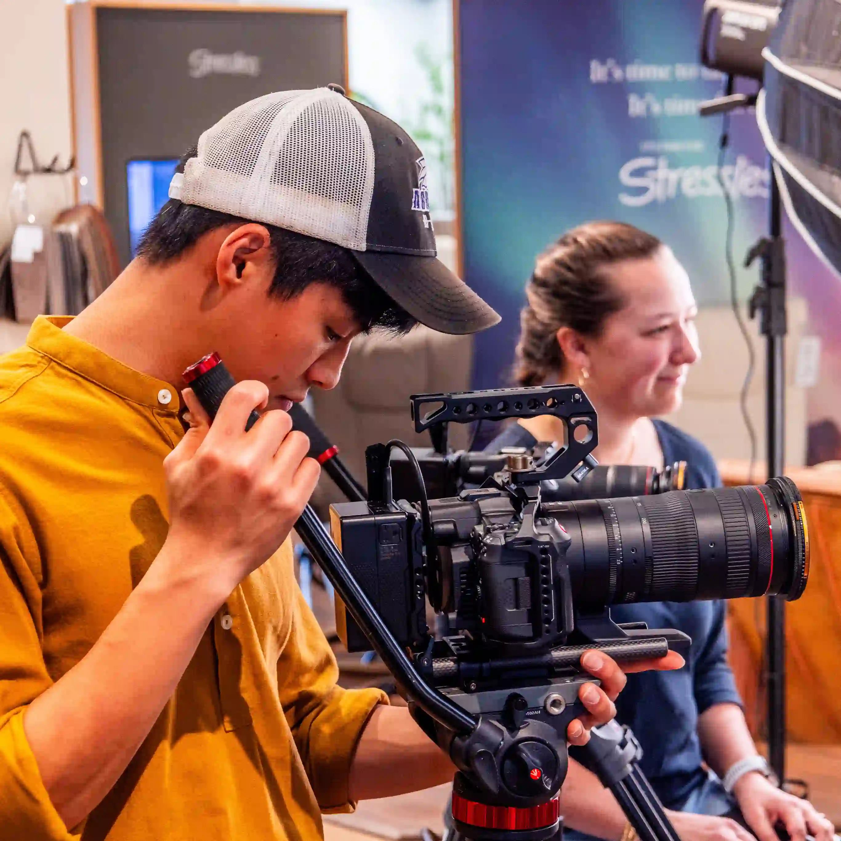 Videographers filming at formal downtown event—Chesser Media live coverage.