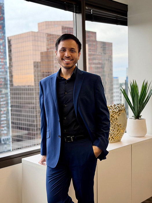 Veura CXO Julius Caesar Magsino in an office smiling for the camera.