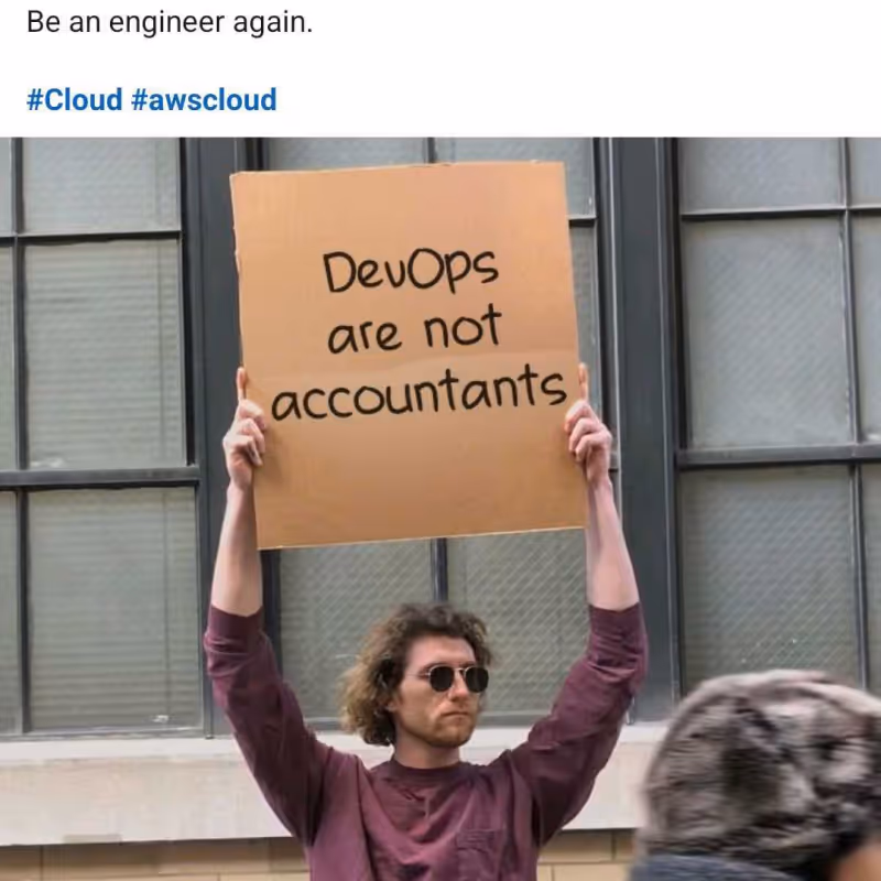 Meme photo: Man holds sign reading “DevOps are not accountants” with caption “Be an engineer again.”