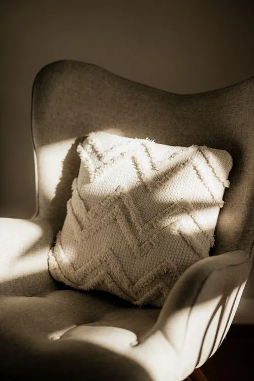 a simple chair in sunlight