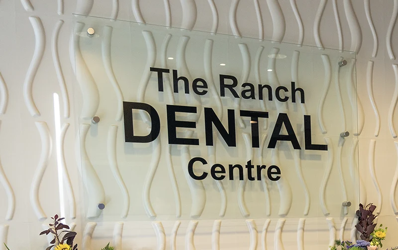 The Ranch Dental Centre logo behind front desk 