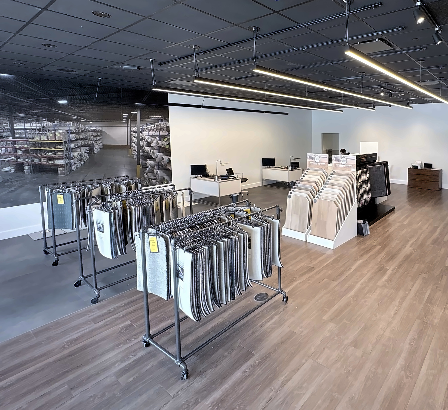 Carpet samples and in-stock rolls inside the Sloane's Carpet Secret Park Meadows showroom
