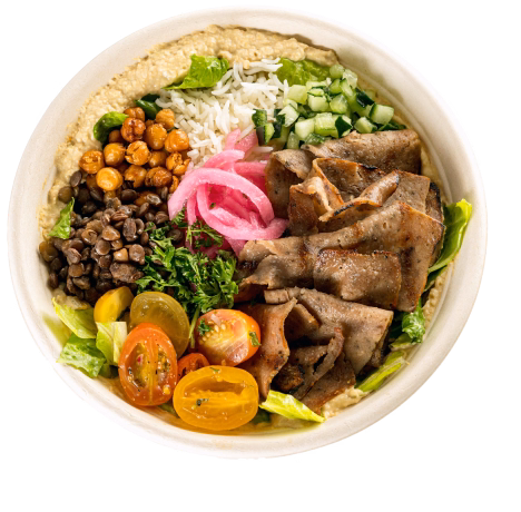 Bowl with sliced beef, chickpeas, lentils, white rice, chopped cucumber, pickled onions, cherry tomatoes, and leafy greens on hummus.
