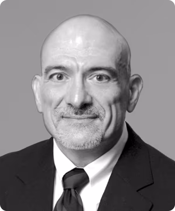 A photograph of a man in a suit