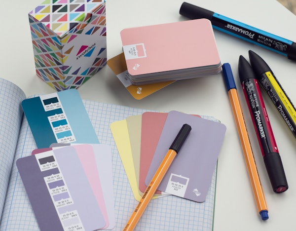 Swatchos color swatch cards being used on a designers desk