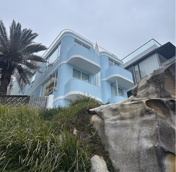 A picture of a baby blue house in Bondi.