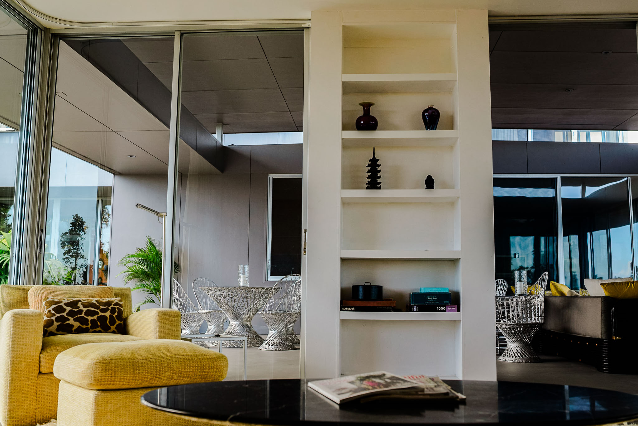 Kitchen and dining area with glass walls on both sides