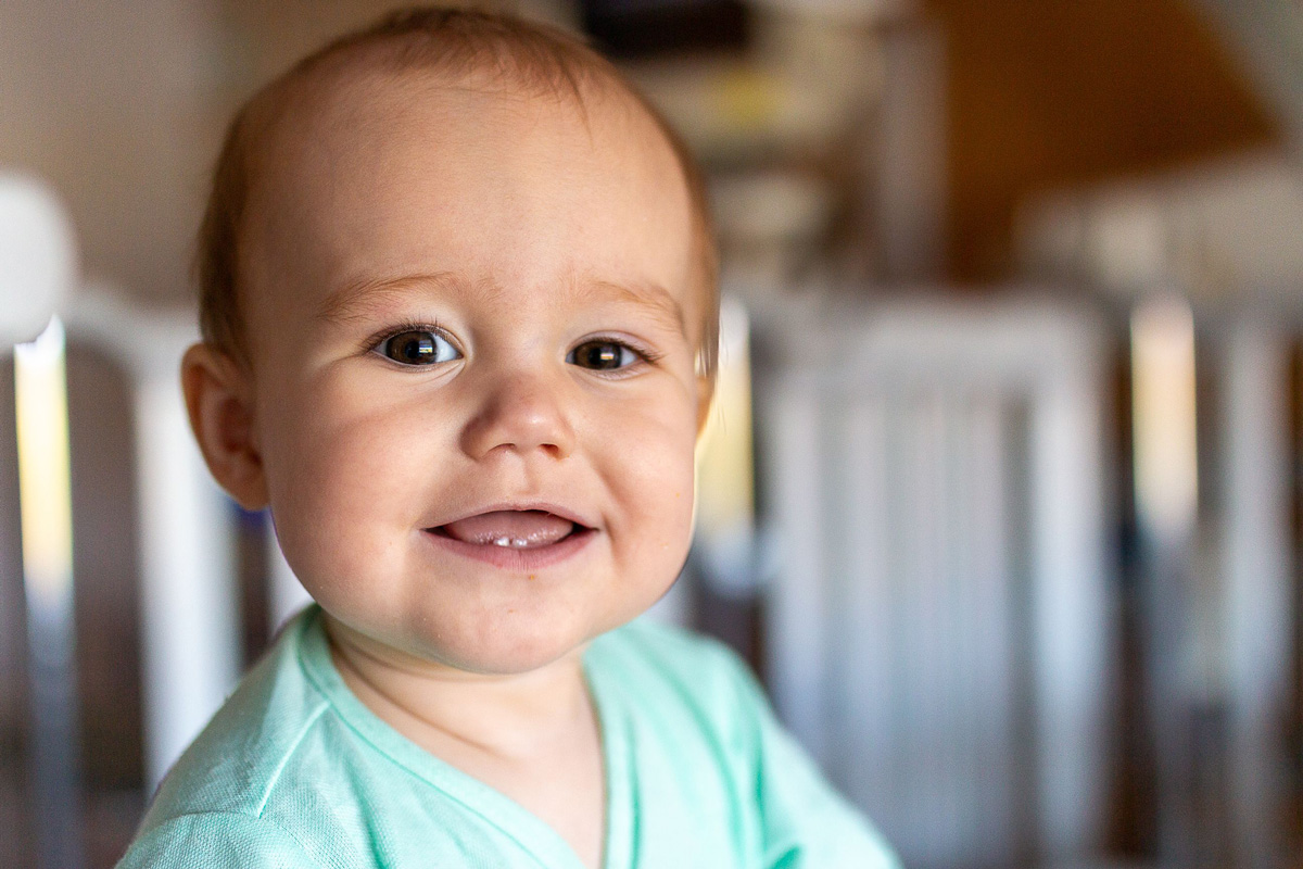 Teething baby smiling.