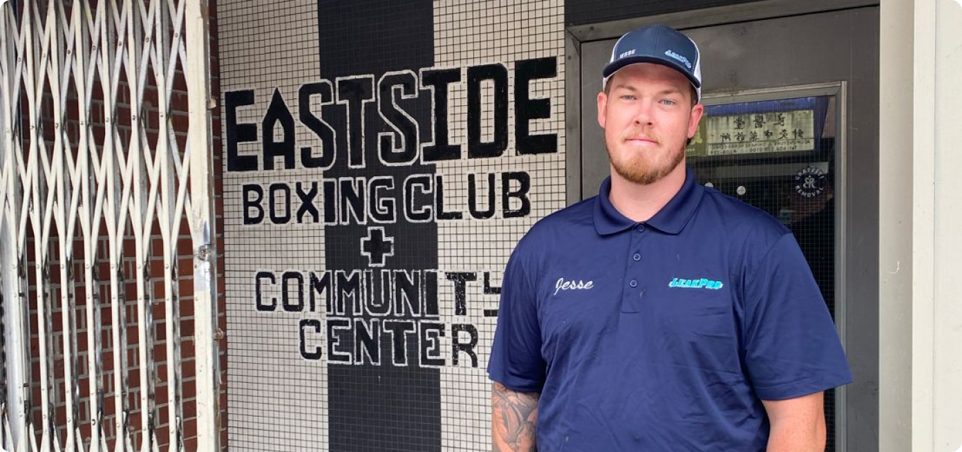 LEAKPRO Franchisee Jesse standing in front of the East Side Boxing Club