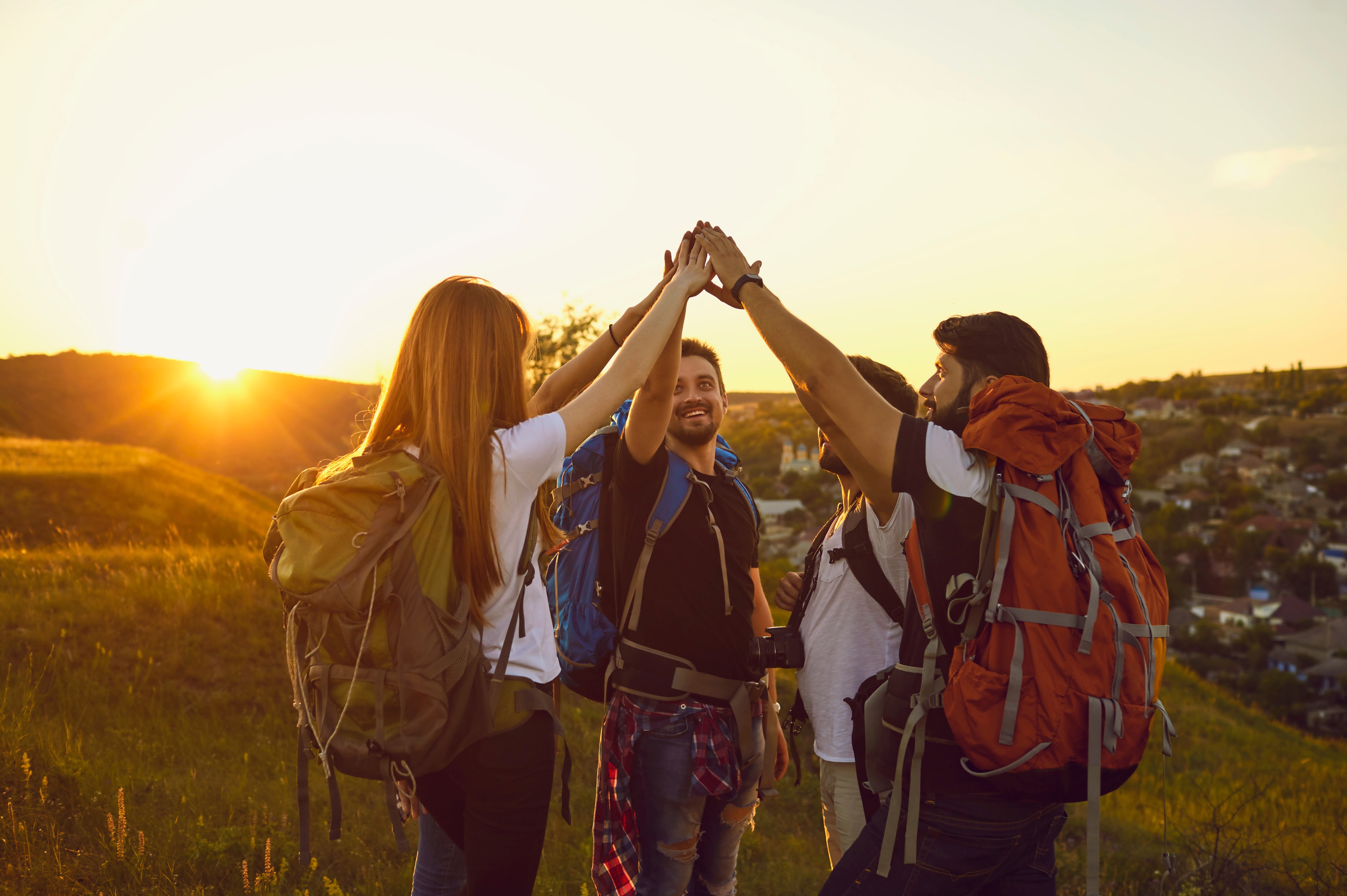 Hikers high fiving over free ai seo tool for small businesses