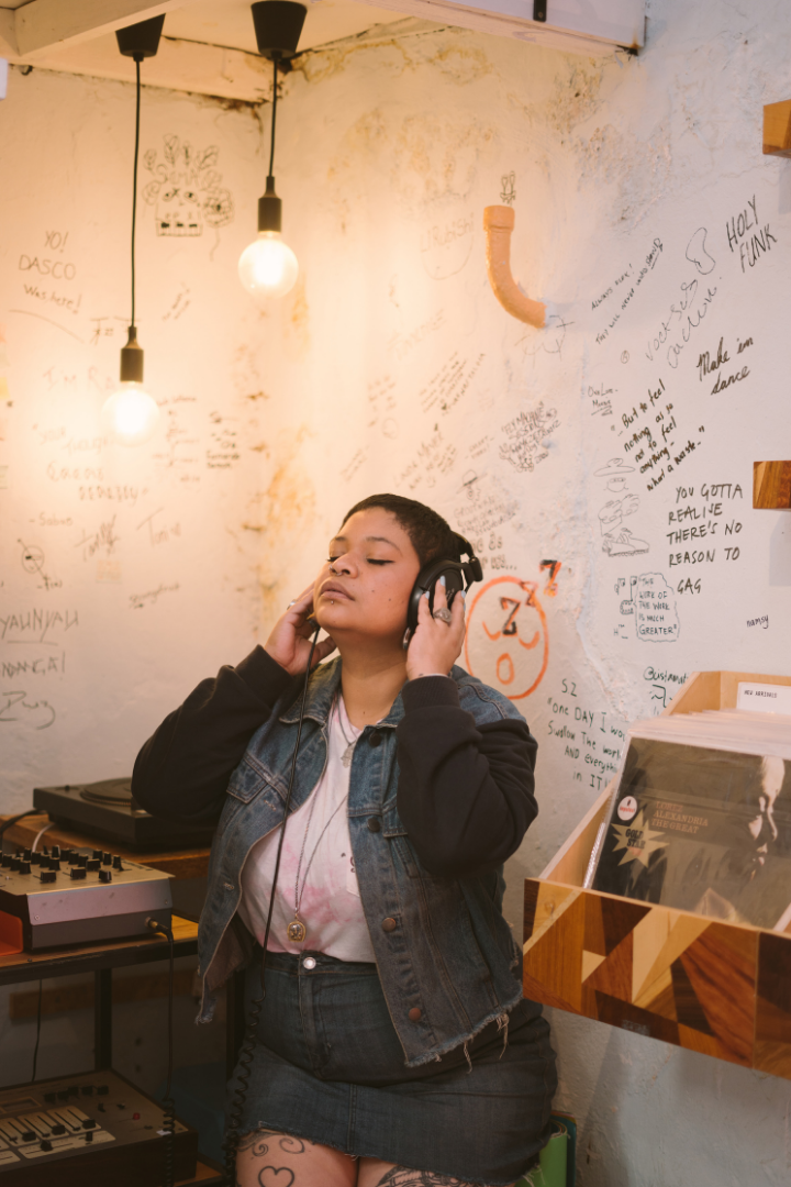 A person listening to music in a creative space enjoying ai search engine optimization for my website